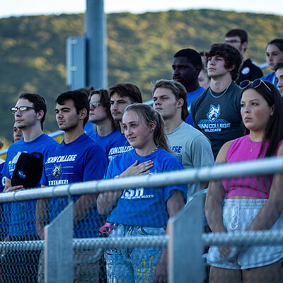 Students stand for the national anthem before the 7 p.m. start of the men's game at UPMC Field.