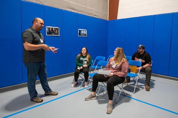 Another corner of the Field House serves as “jail” and “juvenile detention” overseen by William A. Schlosser (left), instructor of emergency management & homeland security. 