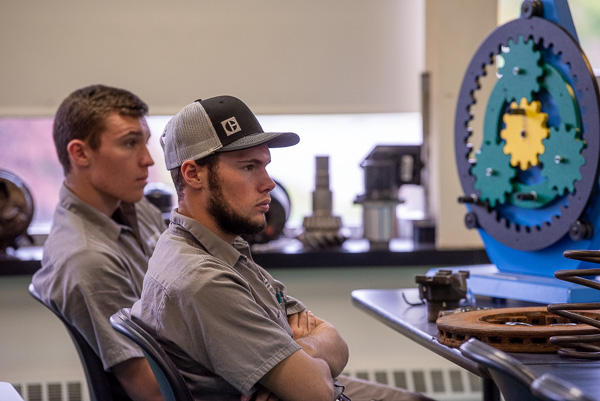 Intently listening to one of the academic presentations are Colby James McHugh (left), of Jim Thorpe, and Thad Reid Boyer, of Westfield, sporting a Foley hat he picked up when the company visited earlier this semester. Both are in their first semester of the heavy construction equipment technology: technician emphasis major.
