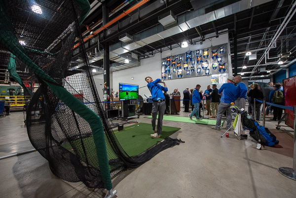 At one of the interactive displays, Wildcat golfer Gavin L. Baer, a manufacturing engineering technology student from Bainbridge, gets in the swing.