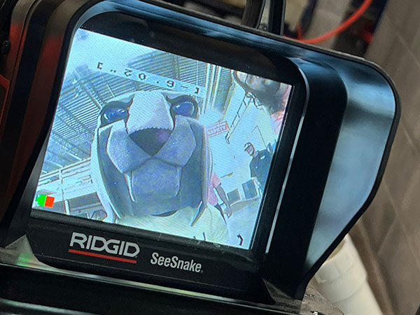 Caution: Objects on screen are cooler than they appear! The Penn College mascot's face enlivens an inspection camera normally used for pipeline inspection.