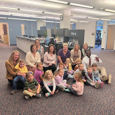 The Bears, comprising 3- and 4-year-olds, bring their contagious smiles to the Office of People & Culture. Appreciative grown-ups (clockwise from left) are Hillary E. Hofstrom, vice president; Madison A. Plesce, generalist; Jennifer L. Whitmoyer, office assistant; Margaret D. McCracken, manager of talent acquisition; Mattie L. Pulizzi, manager of employee engagement; Heather M. Shuey, senior director of employee success; Roxy J. Klinger, coordinator of operations; and Nate Woods, special assistant to the president for inclusion transformation.
