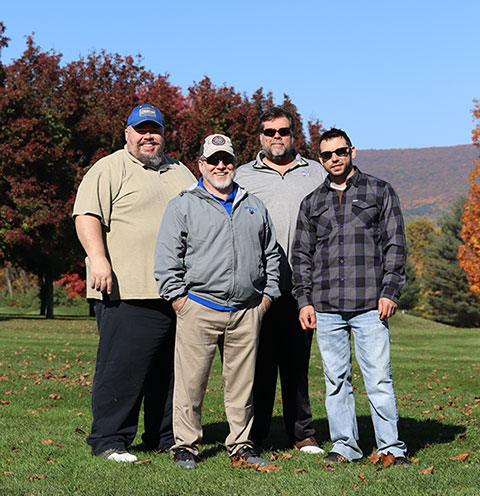 A team of welding faculty moves from the lab to the links. From left are Jacob B. Holland, Michael R. Allen, Michael C. Schelb and Steve J. Kopera ... who had a great time (and the distinction of a last-place finish).