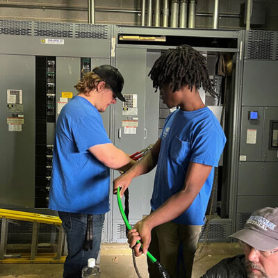 Electrical students employ teamwork in a project of cross-curricular benefit to HVAC students.