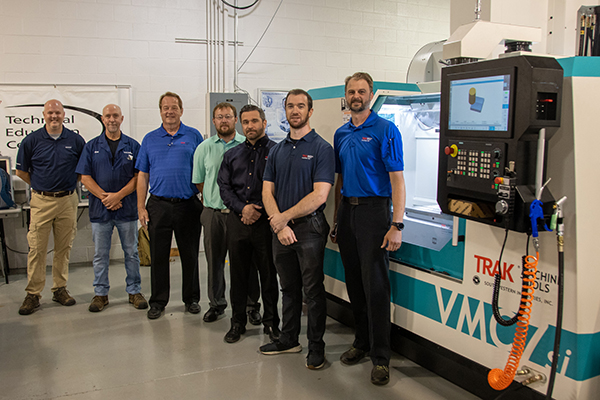 TRAK Machine Tools, the market leader in computer-numerical-control technology for small-lot machining, recently donated two workstations to Pennsylvania College of Technology’s automated manufacturing lab. About 100 students in a variety of majors will receive hands-on experience with the TRAK TMC5 mill and TRAK 1630RX lathe throughout the academic year. From left are Chris Pollack, Siemens Virtual Technical Application Center manager; Richard K. Hendricks Jr., instructor of automated manufacturing and machining; and, from TRAK Machine Tools: Rudy Gebhard, senior sales representative; Derrick Geedy, applications representative; Anthony Cicero, Atlantic regional manager; Kevin Callahan, applications representative; and Kurt Hufnagle, applications representative. 