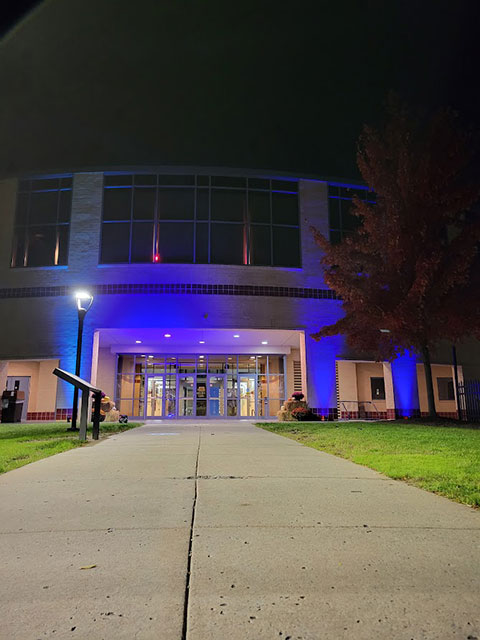 The Campus Center adopts an enticing hue for the weekend, lighting the way for visitors.
