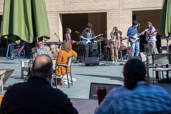 Students of the Uptown Music Collective entertain weekend visitors on the Bush Campus Center patio.