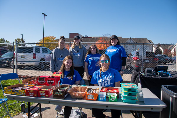 Members of the Wildcat softball team staff a concession table at the women’s soccer game.