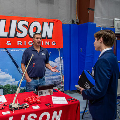 Shawn Lauchle, from Allison Crane & Rigging, gives one-on-one attention to Timothy R. Maguschak, of Weatherly, majoring in construction management.