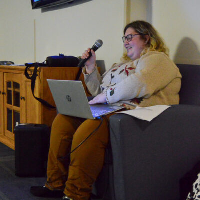 Maya A. Lawton, an event assistant in the Office of Student Engagement, announces the next question while controlling the slideshow with her computer. Lawton, of Coudersport, is enrolled in the Bachelor of Architecture major.