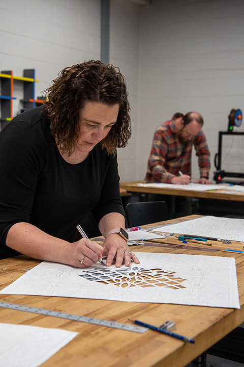 Two of Penn College’s math faculty – Lisa D. Jacobs and Nathan D. Trick – engage in the geometry workshop.