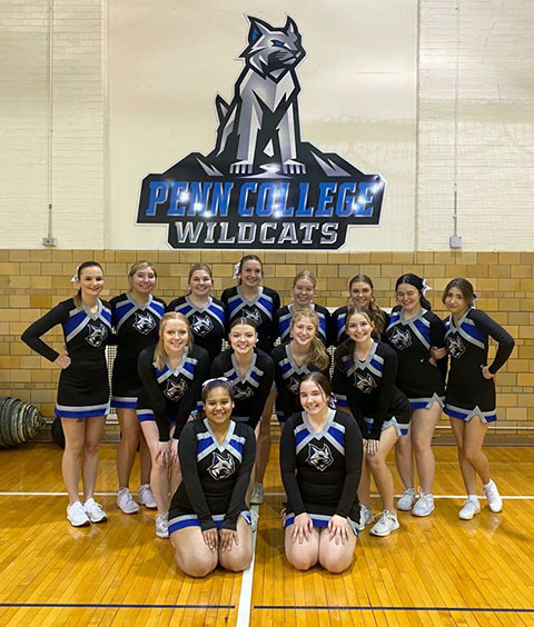 The Penn College cheerleading squad aids the home-court cause at Saturday's men's basketball game against Clarks Summit University ... 