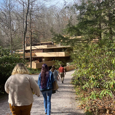 A driveway leads to the entrance of Fallingwater, named for the waterfall that flows beneath the house.
