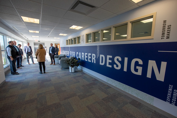 On the third floor of The Madigan Library, Kline leads guests into the Center for Career Design. Pace (far right background) co-led the campus tour. 