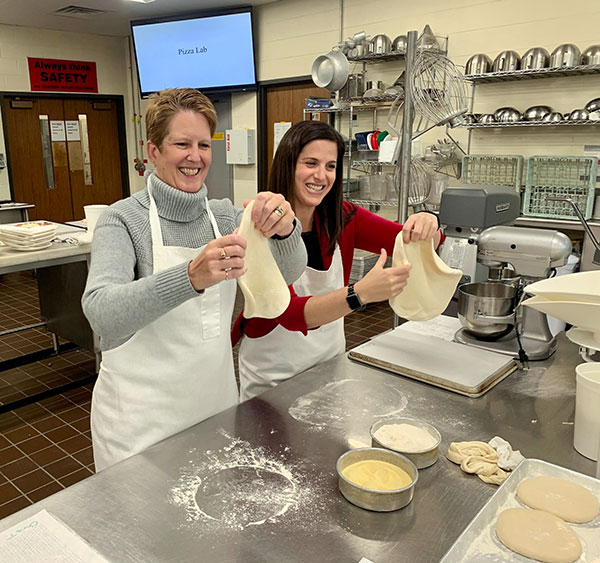 ... before lightheartedly following his example alongside Christine A. Tilburg, PTA clinical director.