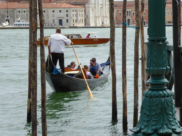 In Venice, students immerse in the experience with a gondola ride.