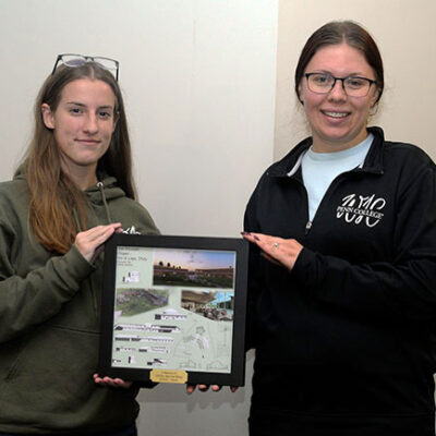 Club Vice President Makenzie E. Witmer (left), a construction management student from Bellefonte, and President Amanda F. Ritter, of Williamsport, a building science & sustainable design: architectural technology concentration student, display the framed poster.