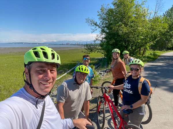Rob Cooley, associate professor of anthropology/environmental science, snaps a selfie with his traveling (and pedaling) companions along the Tony Knowles Coastal Trail.