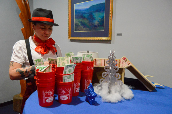 Students were welcome to grab a cup of play money, and a bubble-gum cigar or candy cigarette, in the Thompson Professional Development Center's den of make-believe vice. The money could be used to play such casino games as Texas hold 'em, roulette and craps. 
