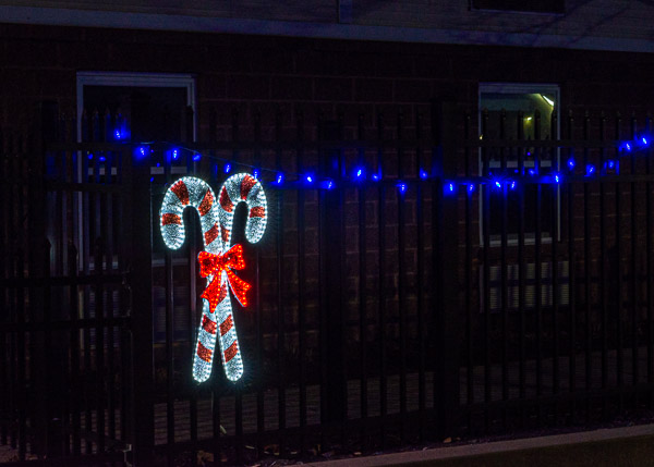 Candy canes line the fence alongside Campus View Apartments ...