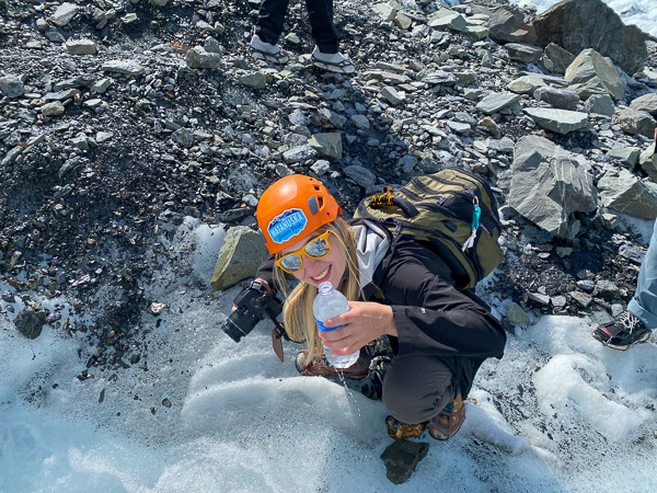 Talk about ice water! Nicole M. Smulligan fills her bottle with glacial melt. 