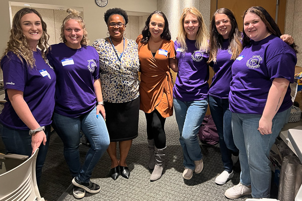 Students celebrate a successful gathering with Theresa Lyons (third from left), YWCA Alaska’s chief executive officer, and Blaze Bell (center), a motivational speaker representing Standing Together Against Rape (STAR Inc.) Alaska.