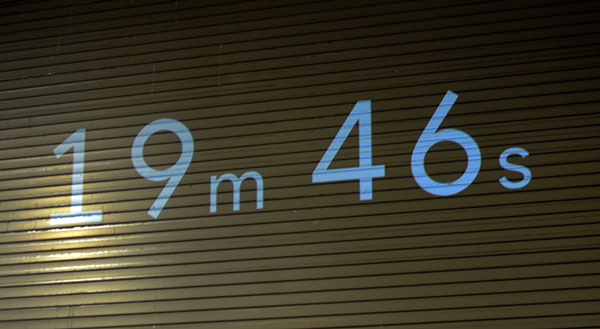 ... and the 20-minute time clock, projected on the lab's garage doors, starts ticking for all to see.