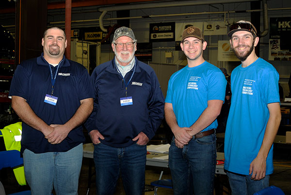 Front and center to judge and facilitate the Fasteners station are (from left) Wagman Inc. employees William Hammel and Alan Houser; and Penn College student volunteers Drew J. Page, of Coudersport, and Matthew J. Biehl, of Silverdale. Both are enrolled in heavy construction equipment technology: Page in the technician emphasis and Biehl in the operator emphasis. (Page did double duty, later donning the mascot's costume to entertain attendees as the Penn College Wildcat.)