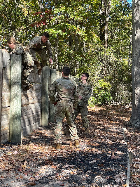 At Ranger Challenge 2022, Cadets Adam T. Roe, a construction management student from Hallstead, and Reaugh provide aid to fellow cadets so they may safely breach the retaining wall.