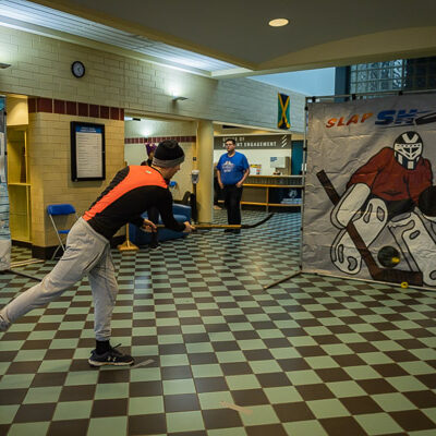 A mock snowball fight and a faux hockey net provide diversion in the lobby.