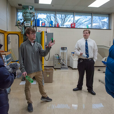 Joining in the excitement of the day are plastics & polymer engineering technology students Ben David Burns (left), of Northumberland, and Zachary J. Geffre, of Williamsport.