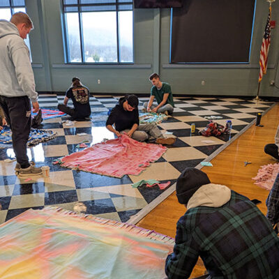 Altrusitic artisans prepare an impressive output to warm the lives of local foster families.