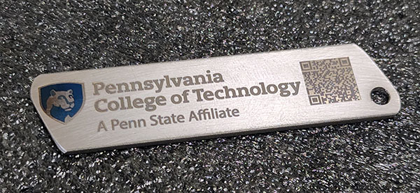 One of the hands-on experiences for Farm Show patrons involved a laser engraver, used to personalize a Penn College-branded keepsake. Manufacturing engineering technology student Jeff L. Martin Jr., of Pittsburgh, designed and manufactured the keychains from donated titanium ... 