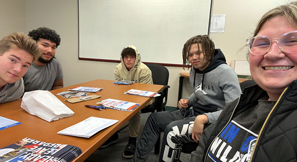 Stauffer talks with four students at Bethlehem Area Vocational-Technical School during a return visit in December.