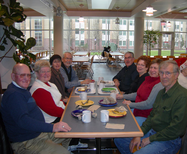 Dietrick (right foreground) enjoys a retirees' get-together in the Keystone Dining Room in December 2011.
