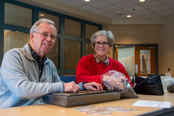 Warren and Lee Robinson, of Trinity Episcopal Church, plant some of the vegetable seeds that will eventually be added to one of three community gardens in Williamsport: at Trinity Episcopal, James V. Brown Library and West End Christian Community Center.