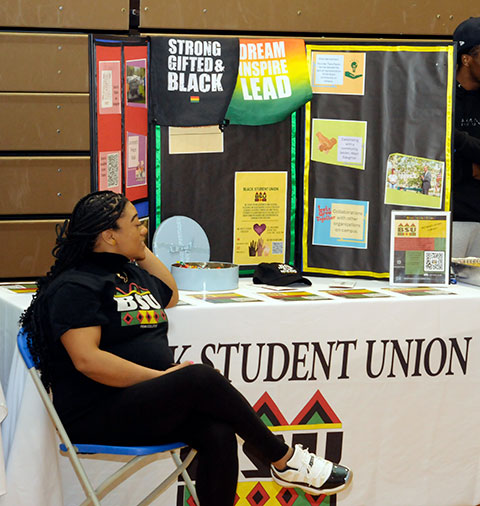 Ashlee E. Massey, of Williamsport, a human services & restorative justice student, staffs the BSU table.