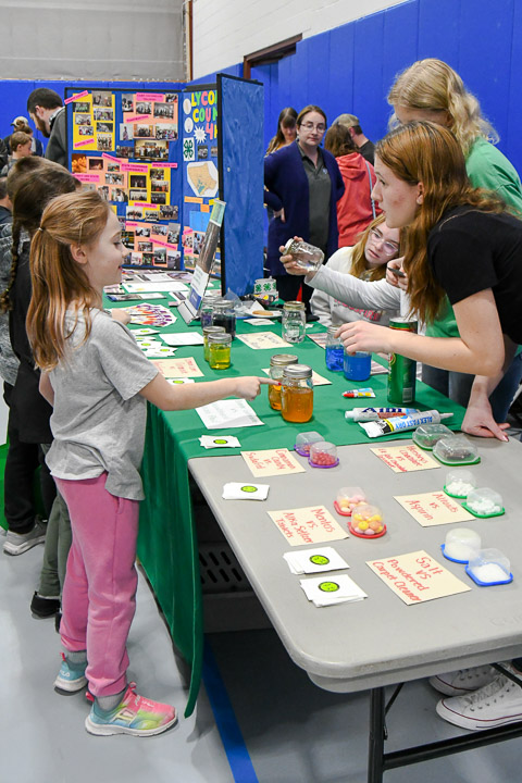Busy interaction at the 4-H Club table