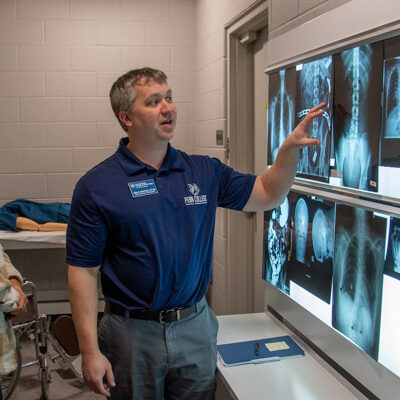 Allen R. Smith, clinical director radiography, reviews X-ray images with a few of the students from Susquehanna County Career & Technology Center.