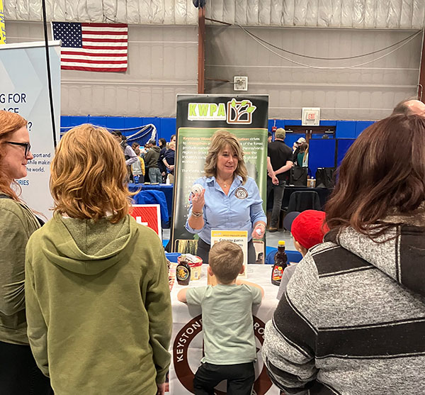 Stephanie Phillips-Taggart, a frequent visitor to campus, engages visitors to the Keystone Wood Products Association booth.<br />
 