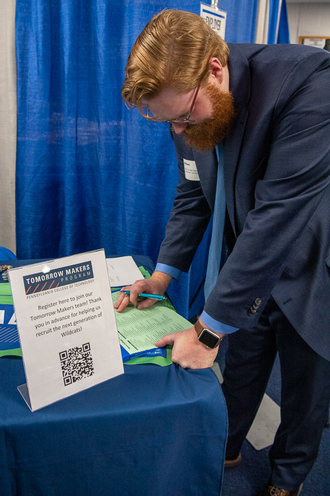 Tomorrow Makers dressed to impress! In the lobby of the Field House, Matthew R. Vonada, a welding & fabrication engineering technology student from Hollidaysburg, scans the long list of employers. 