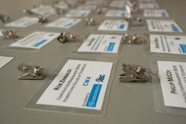 ID tags bearing the names of Career Fair registrants await the arrival of their job-hunting owners.
