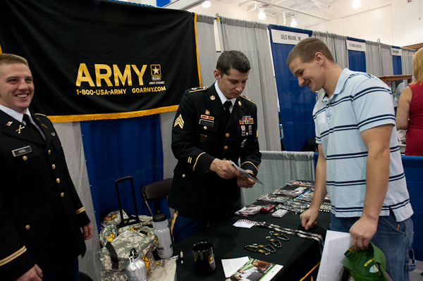 Student Lawrence R. Walker III, a heavy construction equipment technology: technician emphasis major who also serves in the Army, stops by a familiar display.