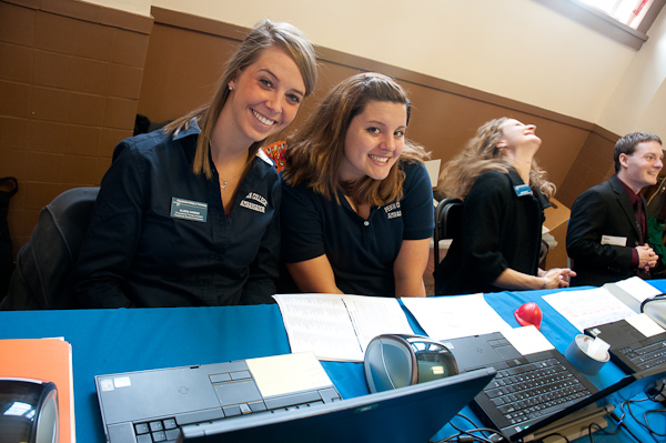 Ambassadors Alissa J. Harris (left) and Jenna M. Harner help with student ID tags.