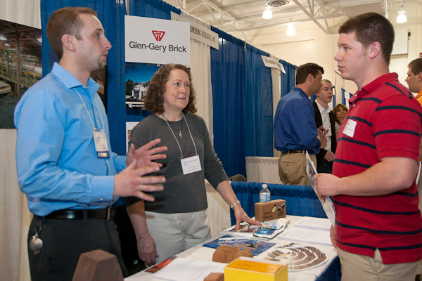 Timothy A. Senavaitis, '08, manufacturing engineering technology, a production engineer with Glen-Gery Brick, and colleague Sarah Colburn talk with Nickolaus A. Furman, a junior in manufacturing engineering technology, from Collegeville.