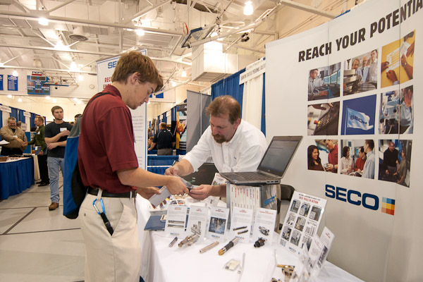 Colin L. Foreman, a senior in manufacturing engineering technology, from Westminster, Md., checks out some products at the Seco Tools booth.