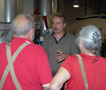 Roy A. Klinger, instructor of automotive technology, talks with visitors to the CAL paint lab 
