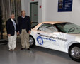 Michael Barrett, executive director of the AACA Museum, joins Colin W. Williamson, dean of transportation technology, alongside Pennsylvania College of Technology's contribution to the exhibition
