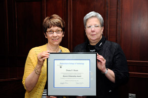 Dona Bean, of DuBois, Alumni Humanitarian/Citizenship Award recipient, with President Gilmour