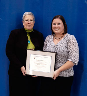 Pennsylvania College of Technology President Davie Jane Gilmour presents Outstanding Varsity Athletic Alumni Awards to Amber L. Dreese, of Williamsport. (Photo by Michael S. Fischer, student photographer)